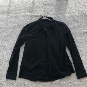 Black woman’s lace button up